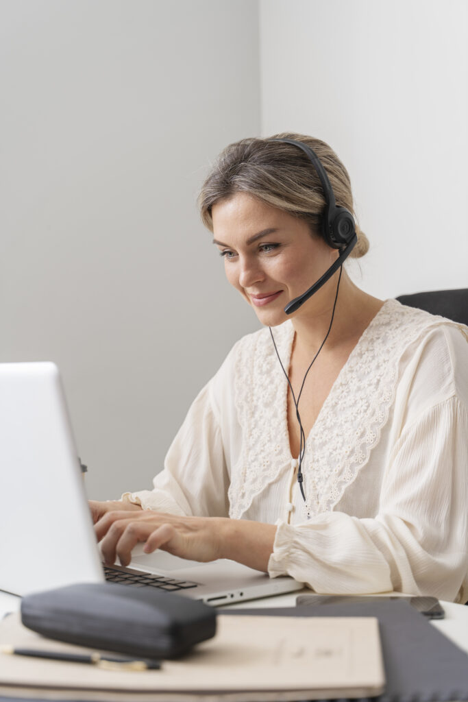 Woman customer service at the desk with headset